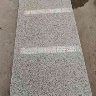 渭南芝麻白光面毛板